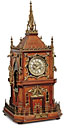 A French gothic revival brass-mounted oak striking mantel clock
