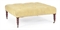 A YELLOW VELOUR BUTTON-TUFTED OTTOMAN,  