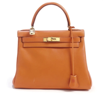 AN HERMÈS ORANGE LEATHER KELLY BAG,  